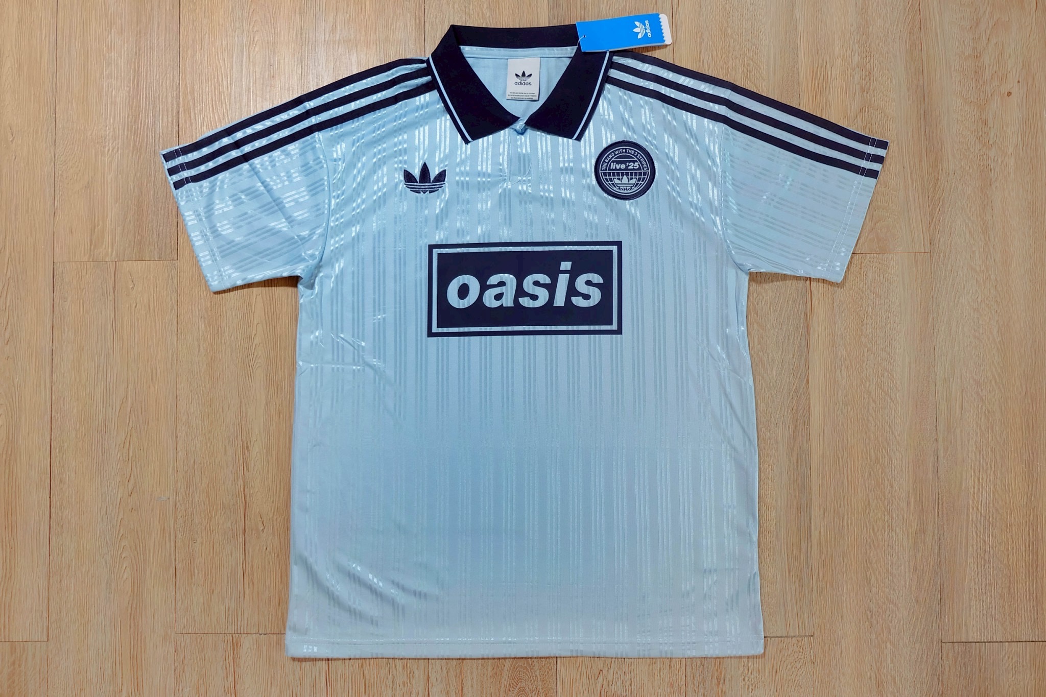 เสื้อเชิ้ตผู้ชายสีดำ/ฟ้า Oasis Special Edition พร้อมเบอร์ 25 เกรดเเฟนบอลพรีเมี่ยม 2025