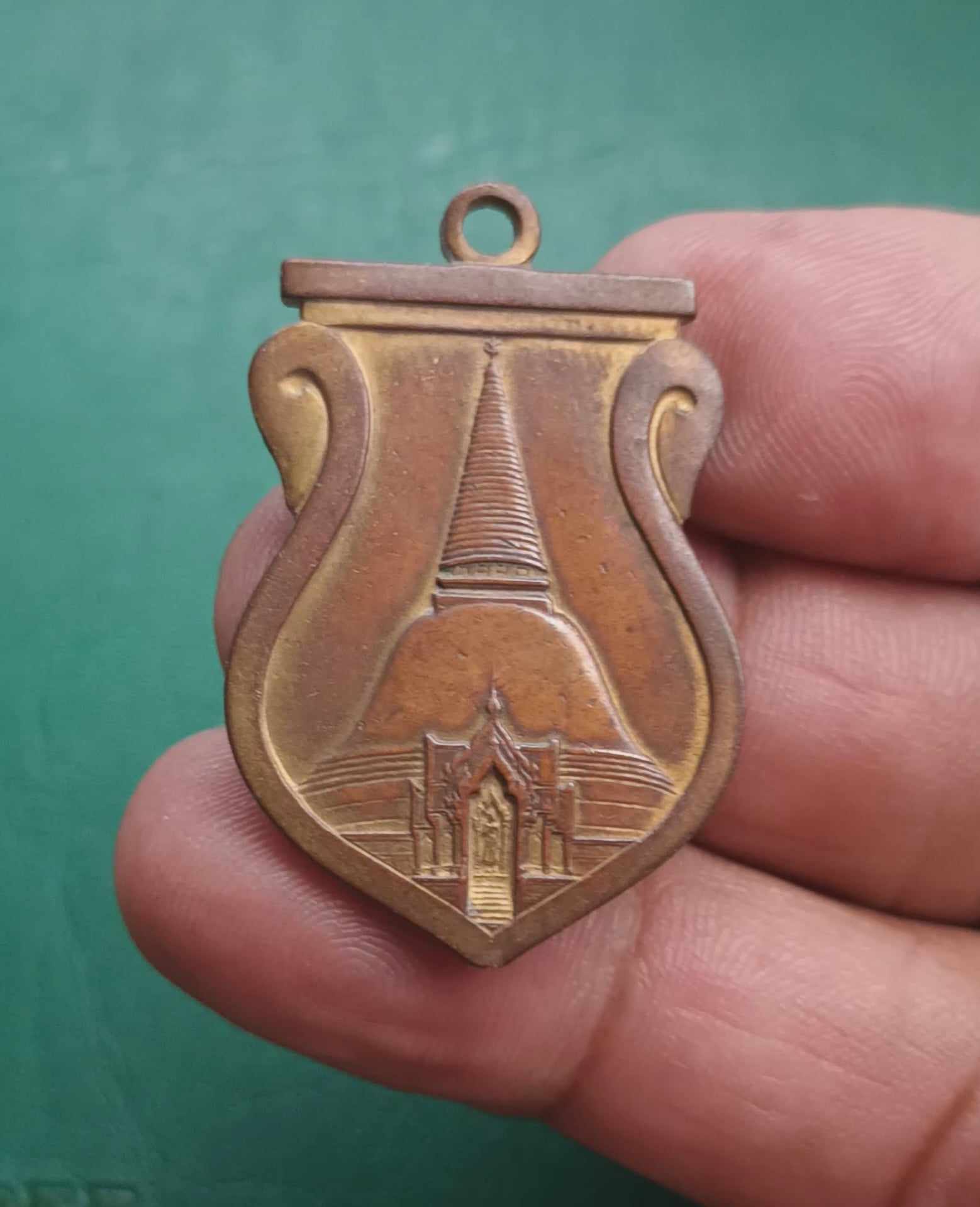 เหรียญเสมาองค์พระปฐมเจดีย์ รุ่นแรก ปี 2465เนื้อทองแดงผิวไฟ