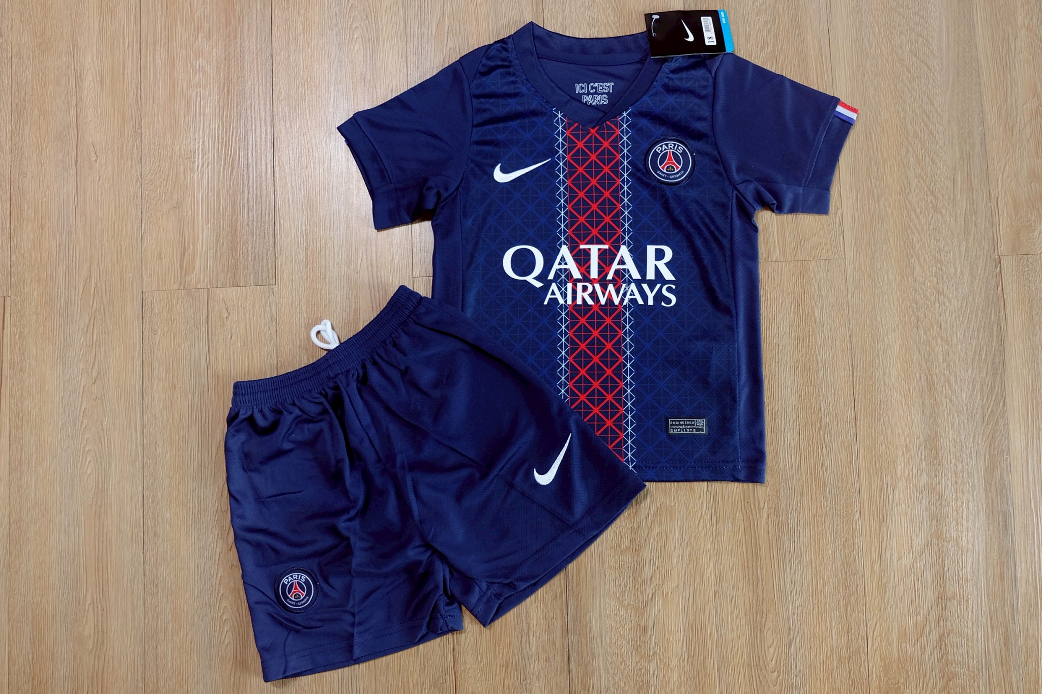 ชุดฟุตบอลเด็ก – เปเเอซเซ เหย้า สีกรม Fans Edition เกรดแฟนบอล 2026