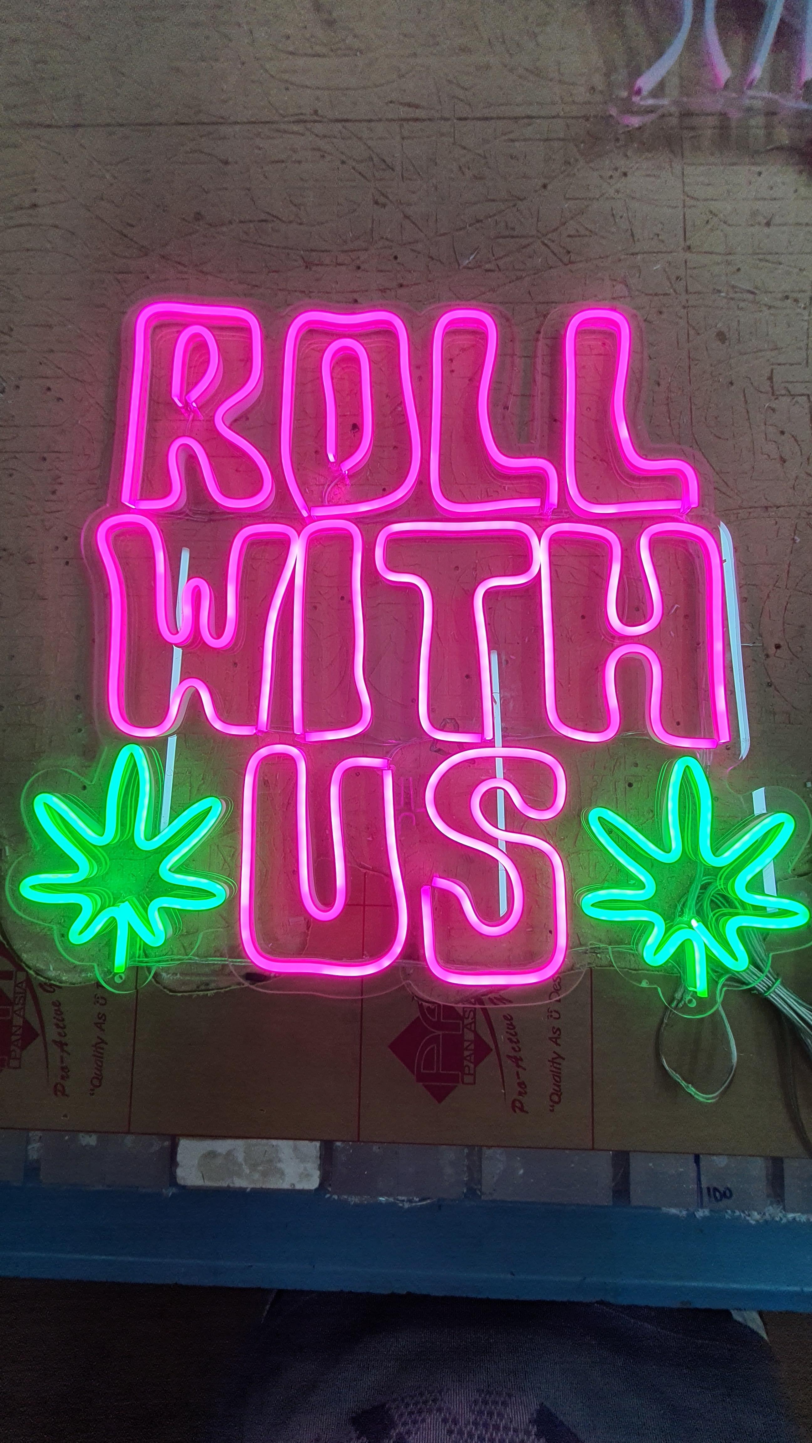ป้ายนีออนฟรค สีชมพู สีเขียว ROLL WITH US